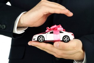 depositphotos_71143047-stock-photo-man-holding-model-of-car